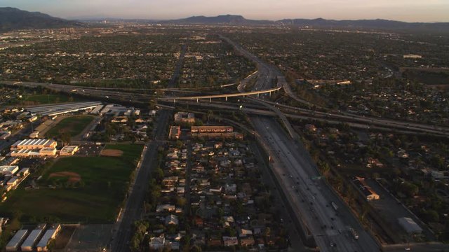 Flying to orbit a complex highway interchange in Los Angeles. Shot in 2010.