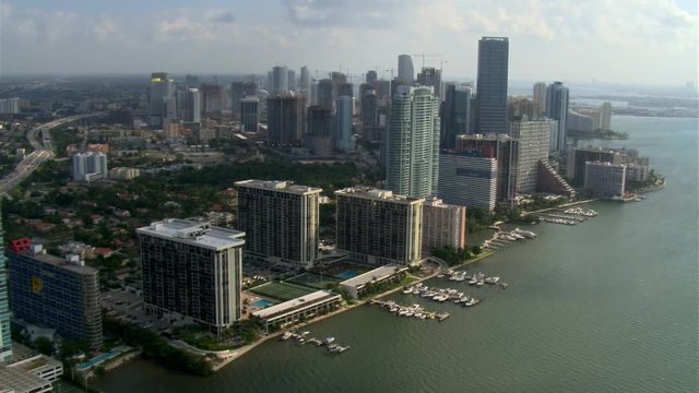 Flying north along Biscayne Bay and Miami waterfront. Shot in 2007.