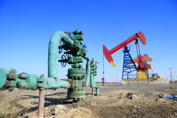 Fototapeta na wymiar Oil field scene, Oil pipeline and pumping unit