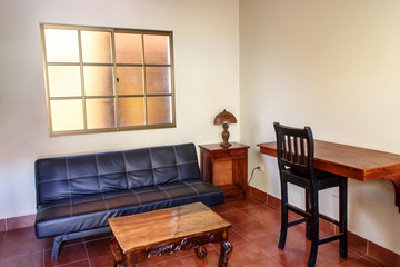 small office with table, chair and sofa