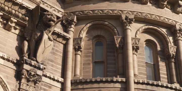 A winged lion gargoyle on an ornate building