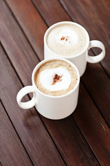 Cup of Cappuccino Coffee On the Wood Table.