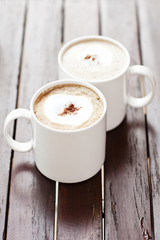 Cup of Cappuccino Coffee On the Wood Table.