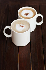 Cup of Cappuccino Coffee On the Wood Table.