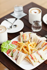 Club Sandwich with Cheese, Pickled Cucumber, Tomato and Smoked M
