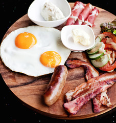 Breakfast - fried egg with bacon and cheese
