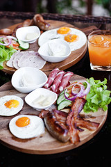 Breakfast - fried egg with bacon and cheese