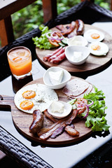 Breakfast - fried egg with bacon and cheese