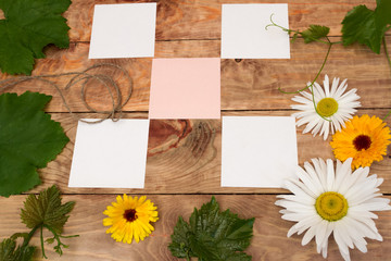 wooden surface with grape vines and flowers