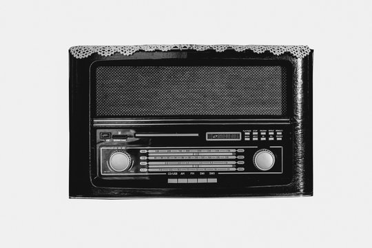 Black and white vintage radio on white background, filtered colo