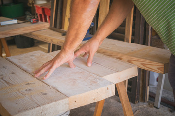 Carpenter working in his small 