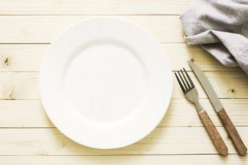 Empty Plate And Cutlery On The Wooden Table./Empty Plate And Cutlery On The Wooden Table