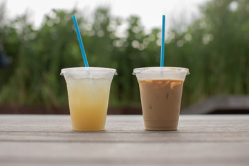 Two cups of refreshment on the bench 