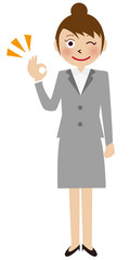 灰色のスーツの女性　ＯＫポーズ
