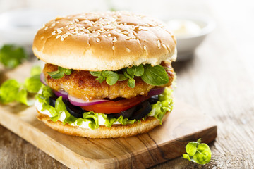 Burger with chicken and olives