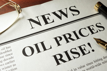 Newspaper with header news and Oil prices rise.