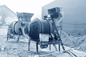 Old cement mixers in the construction site