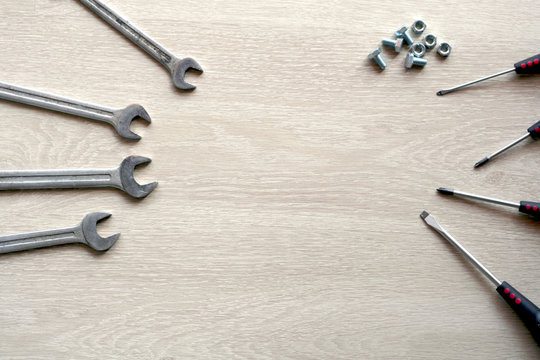 Mechanic tools with wooden background. Top view with copy space