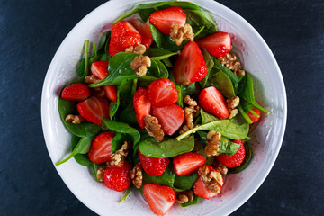 Summer Fruit Vegan Spinach Strawberry nuts Salad. concepts health food