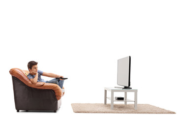 Bored little boy watching TV
