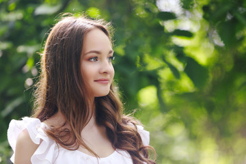 Beautiful girl relaxing in green park