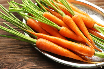 Carrots on metal plate, closeup