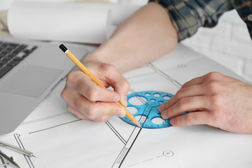 Man working with engineer blueprints