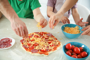 Kids with parents cooking dinner