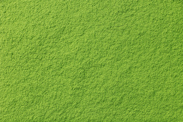 Powdered matcha green tea background, closeup