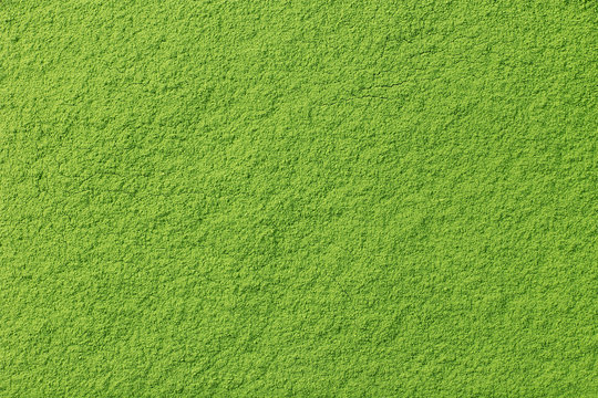 Fototapeta Powdered matcha green tea background, closeup