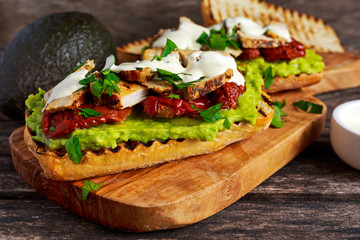 Avocado Sandwich with sunshine dried tomatoes, roasted pork and sauce herbs