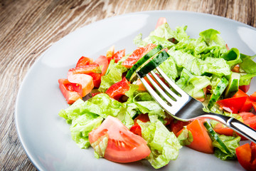 Organic vegetable salad on the wooden table