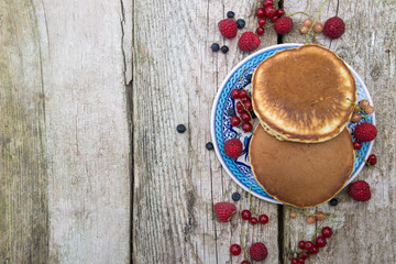 Delicious pancakes close up, with fresh berries