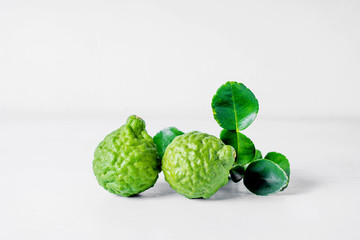 Fototapeta premium Bergamot fruit on white wooden background .