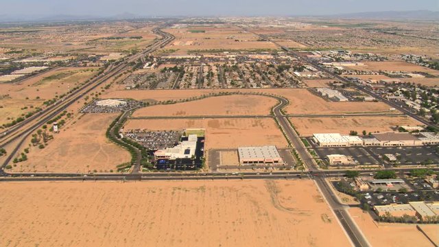 Long approach to Phoenix over arid outlying communities. Shot in 2007.