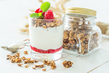 Granola with rasberry and yogurt in glass