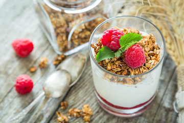 Granola with rasberry and yogurt in glass