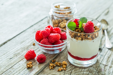 Granola with rasberry and yogurt in glass