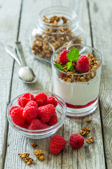 Granola with rasberry and yogurt in glass