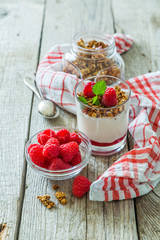 Granola with rasberry and yogurt in glass