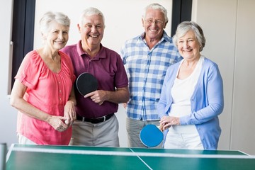 Seniors playing ping-pong - obrazy, fototapety, plakaty