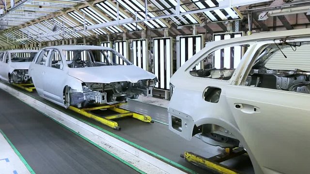 cars in a row at car plant