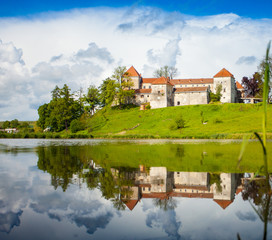 Naklejka na ściany i meble Old castle surrounded with summer nature
