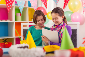 Two girls having fun on birthday party