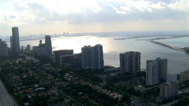 Flight toward Biscayne Bay over cloudy Miami. Shot in 2007.