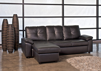 Brown leather sofa with stool for office