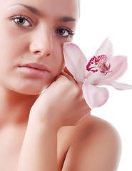 face of woman and orchid