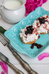 Breakfast of sandwiches with cheese and jam from blueberries.