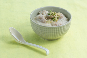 porridge rice gruel in bowl with pork
