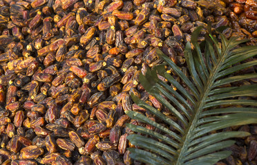 background of fresh figs with a palm twig